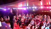 a man is standing in front of a crowd of people